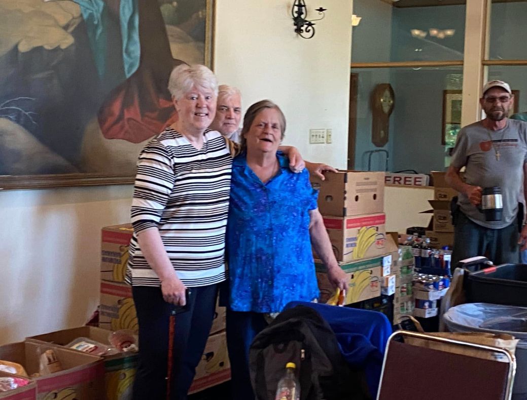 Community members and volunteers sharing a warm moment