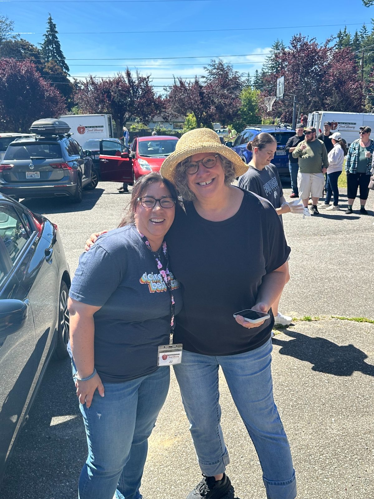 Pastor Christine and JJ smiling at the Everett distribution