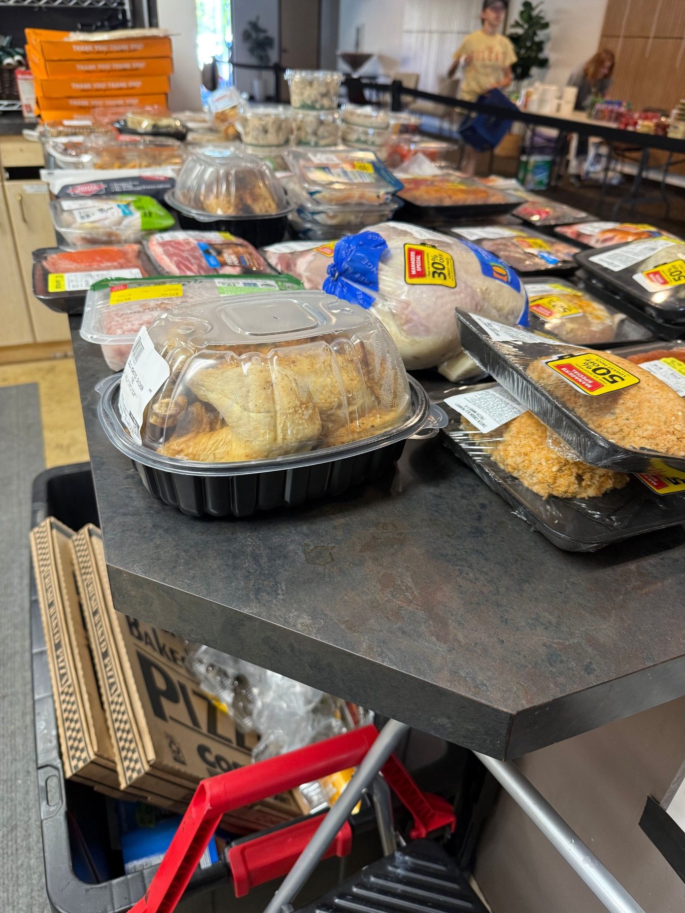 Fresh meat, prepared foods, and rescued groceries ready for the Hope Church distribution
