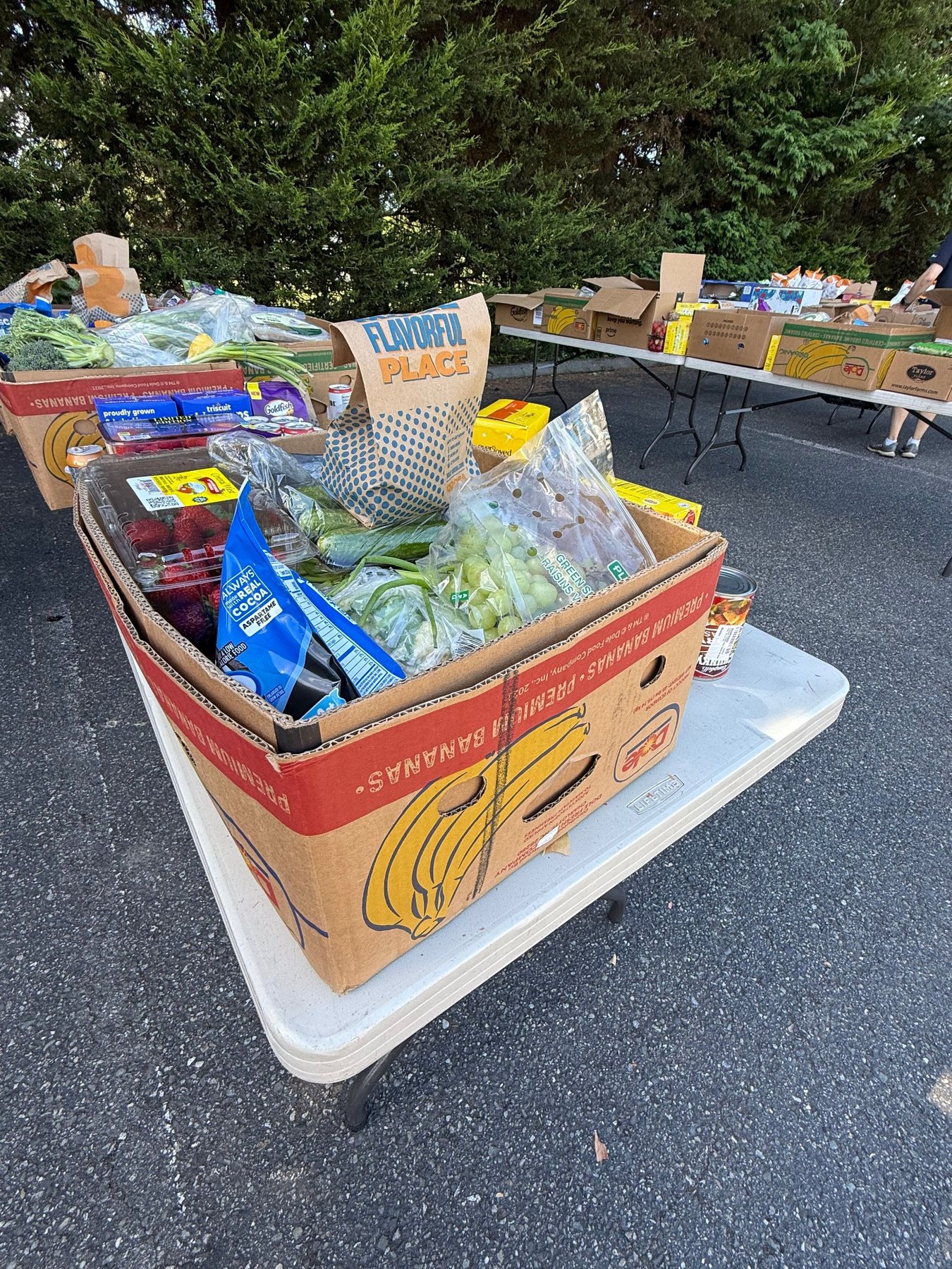 Boxes of fresh produce and groceries arranged for distribution at Hope Church