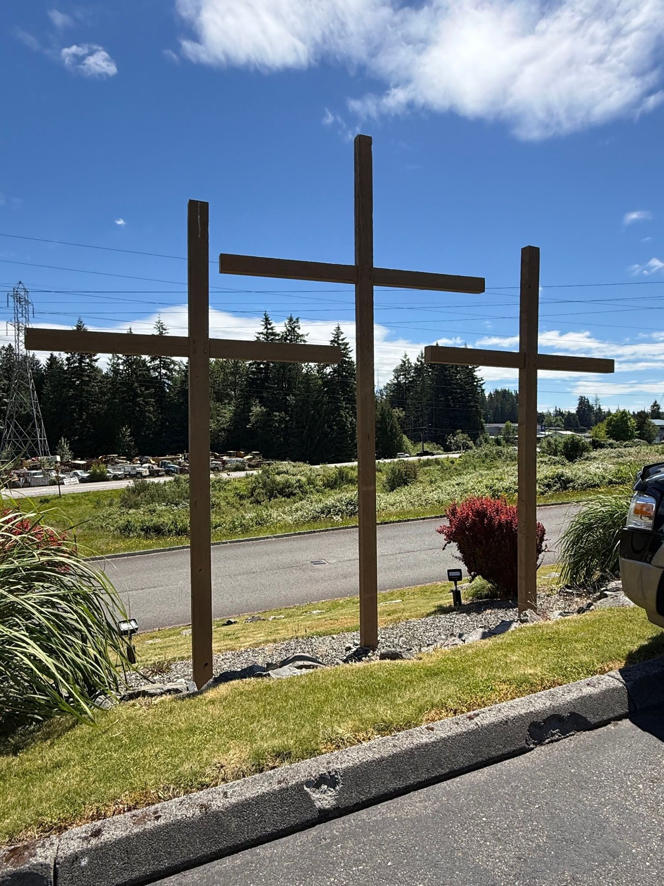 Three wooden crosses outside Hope Church in Snohomish