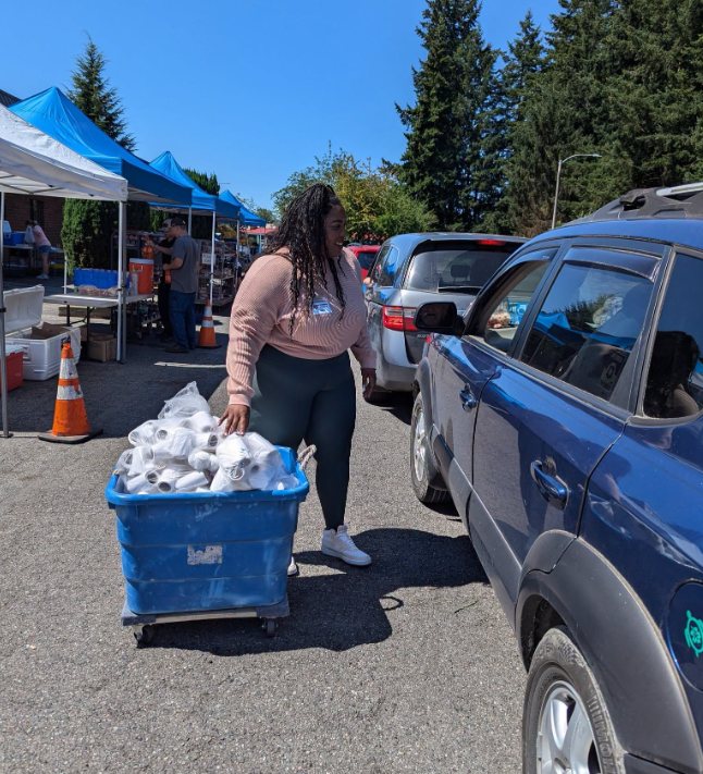 Volunteer helping distribute food