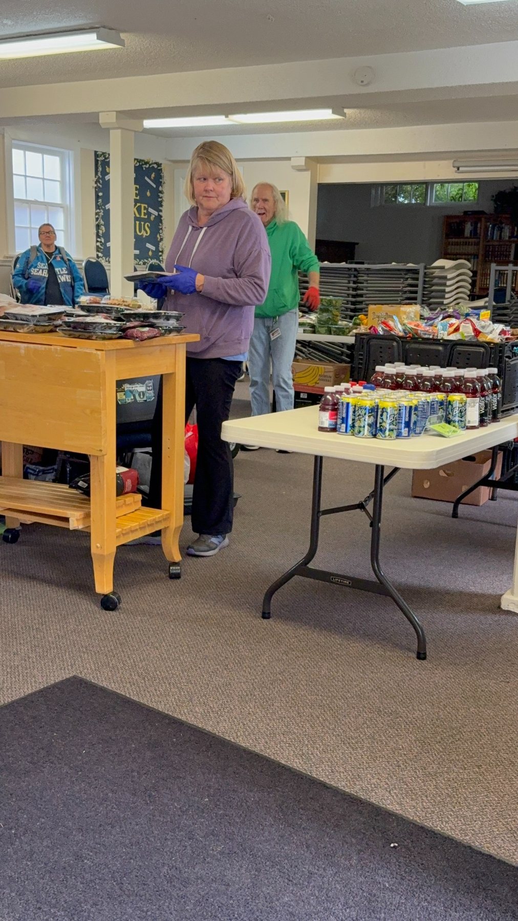 Volunteers preparing food at Midnight Cry Church for the Sunday distribution