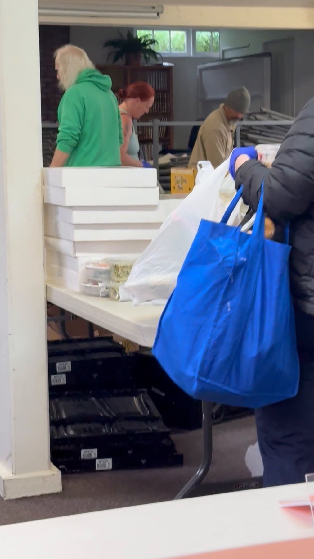 Volunteers arranging food tables at Midnight Cry