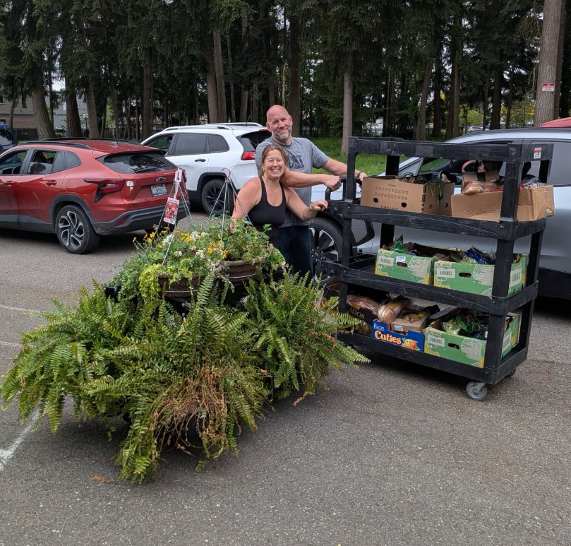 Volunteers delivering boxes and flowers