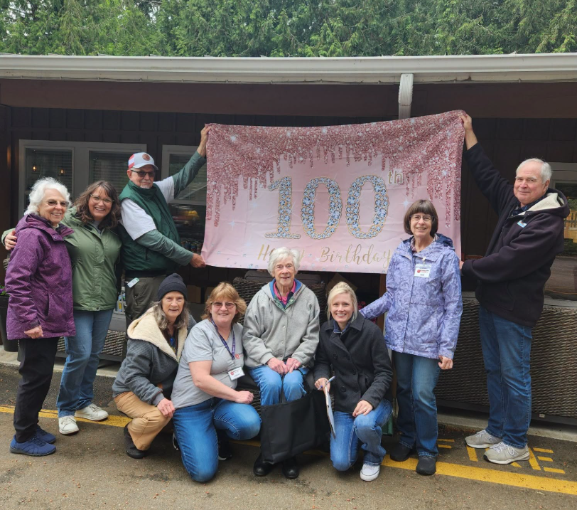 Volunteers celebrating a senior in the community